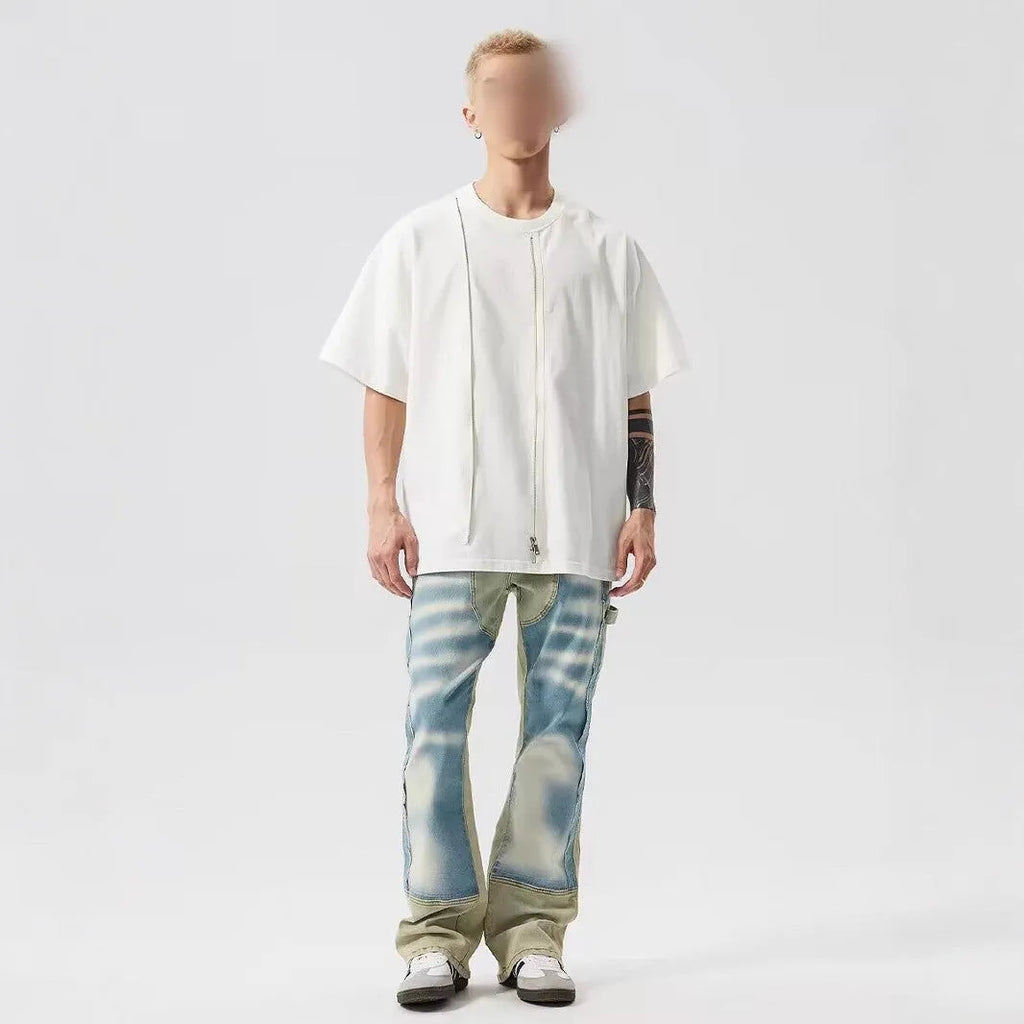 Yellow and blue retro patchwork jeans with splash-ink and distressed detailing on a mid-rise denim fit