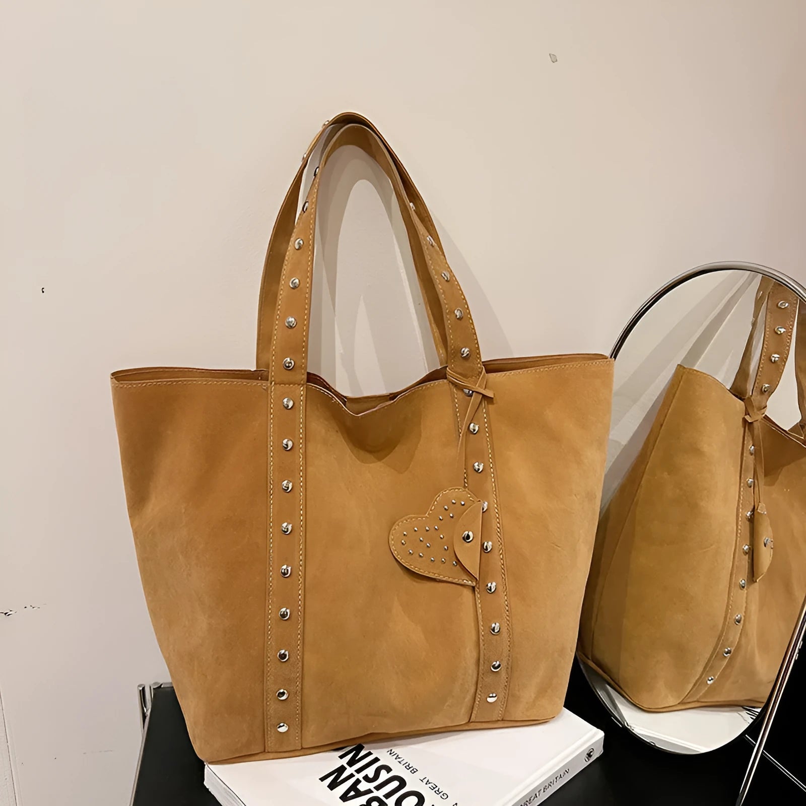 PU tote bag with double shoulder straps in black showing horizontal square shape and sandwich pocket exterior