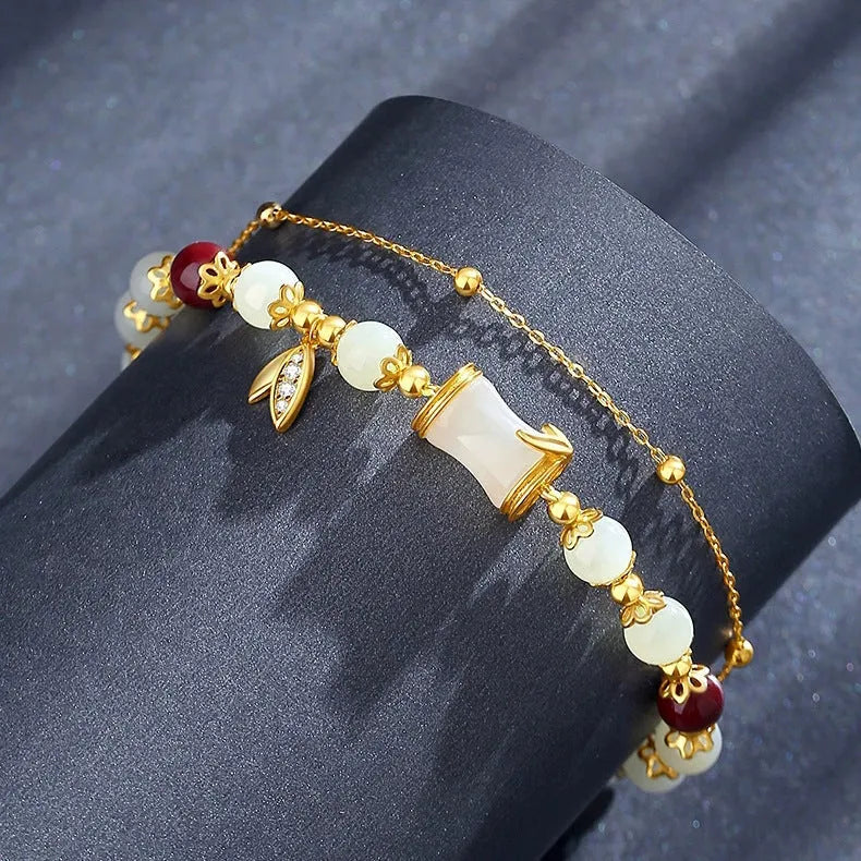 Retro bamboo design bracelet with Ruyi symbol and floral glass beads in electroplated finish