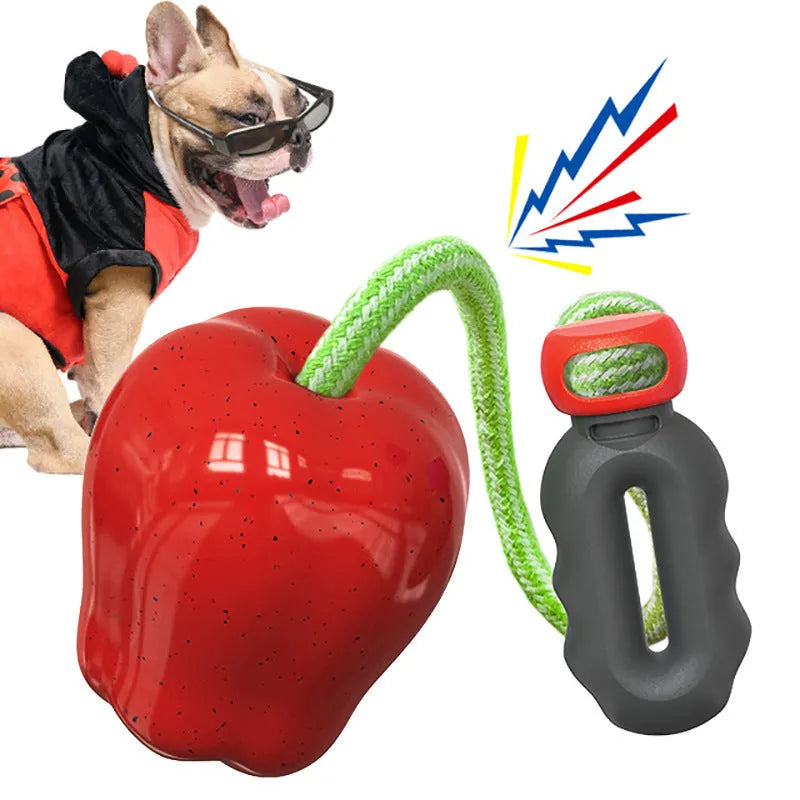 Green and red Apple-shaped dog molar toy with food-dropping ball design for outdoor canine enrichment