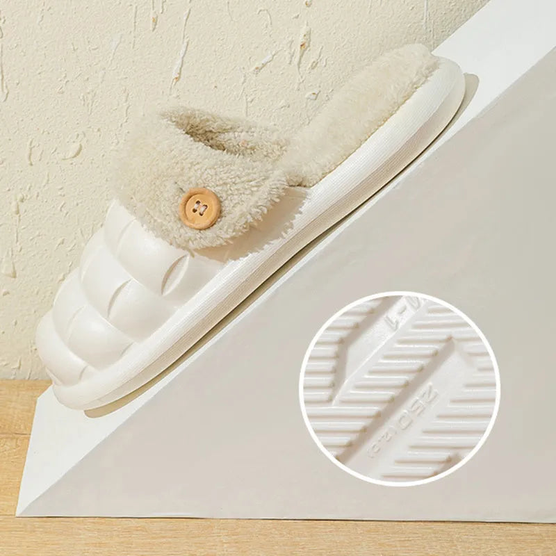 Plaid detachable EVA slippers with plush lining in pink, shown on a foot.