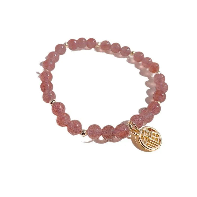 Handmade women's glass bracelet with strawberry quartz beads and blessing card