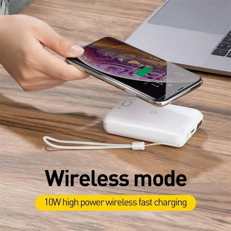 Small square black 10000mAh power bank with wireless charging symbol and digital display.