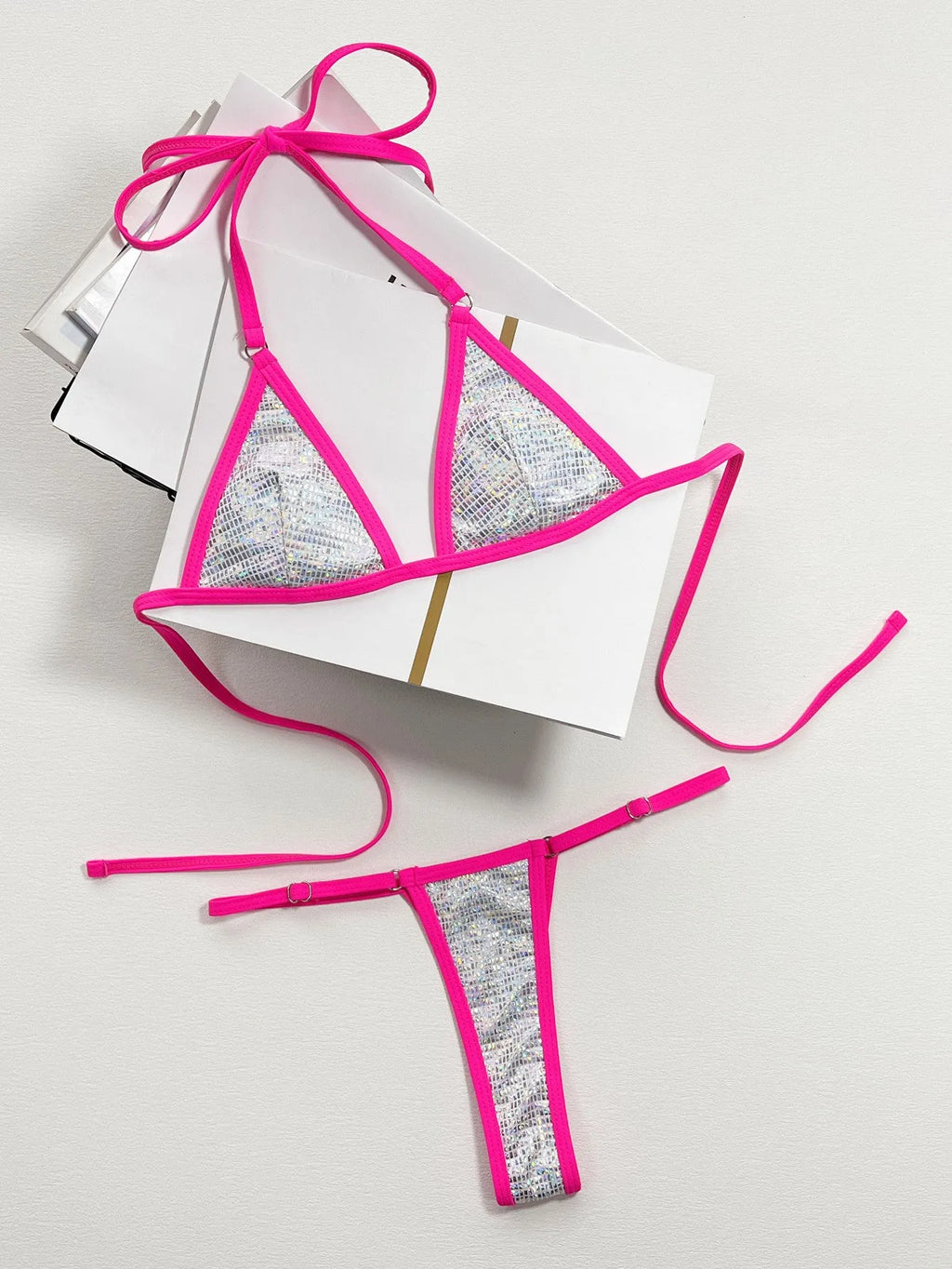 Silver women's split triangle bikini top on a white background.