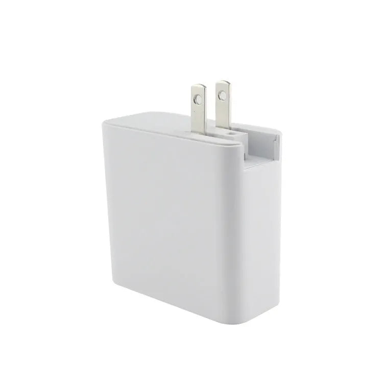 Black four-port USB-C wall charger with UK, US, EU, and AU plug adaptors on a white background.