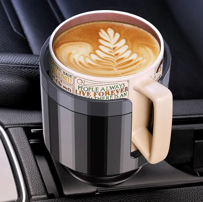 Matte black adjustable car cup holder expander for large bottles installed in a centre console.
