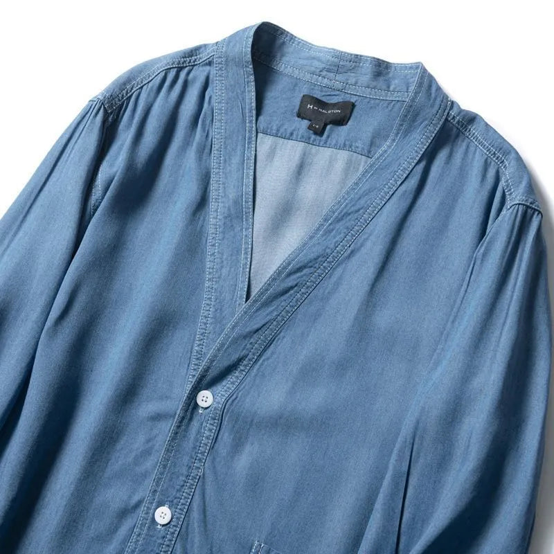 Men's dark blue three-quarter sleeve V-neck casual denim coat laid flat.