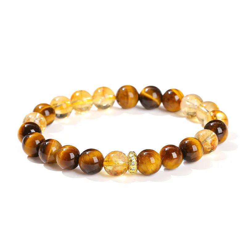 Natural yellow tiger's eye crystal bracelet with mixed yellow tower charms on wrist