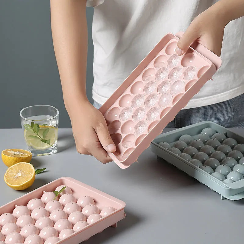 Sky blue 3D round ice mould tray with easy-release design showing spherical ice ball compartments