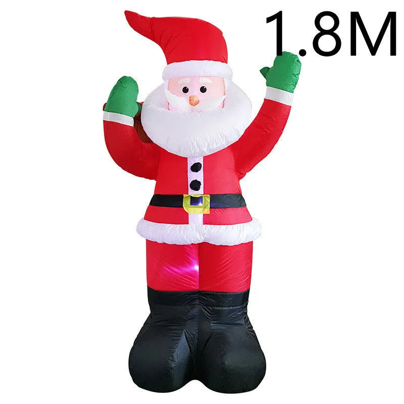 Glowing LED inflatable Christmas decorations including Santa, snowman, and a Christmas tree for outdoor garden use.