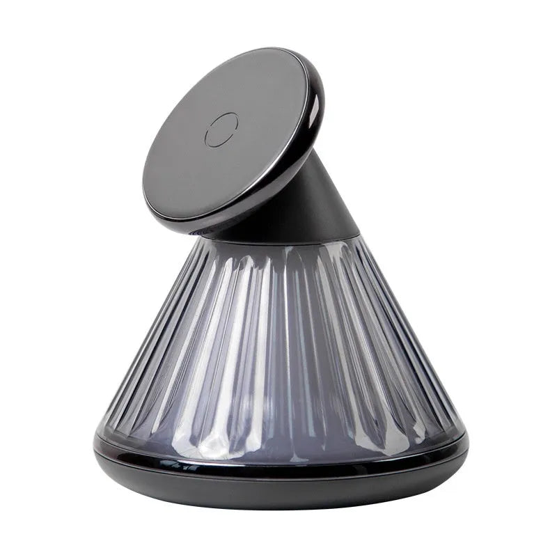 Night table lamp with integrated wireless charging station showing magnetic seat for smartphones