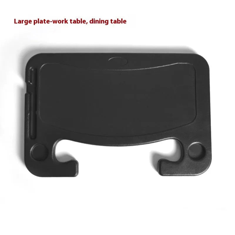 Black foldable car steering wheel laptop stand with a drink cup holder on a table.