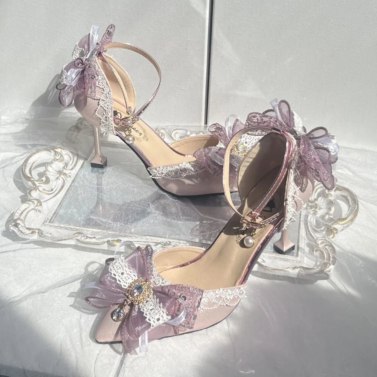 Purple satin Lolita wedding shoes with a square toe and stiletto heel on a composite sole.