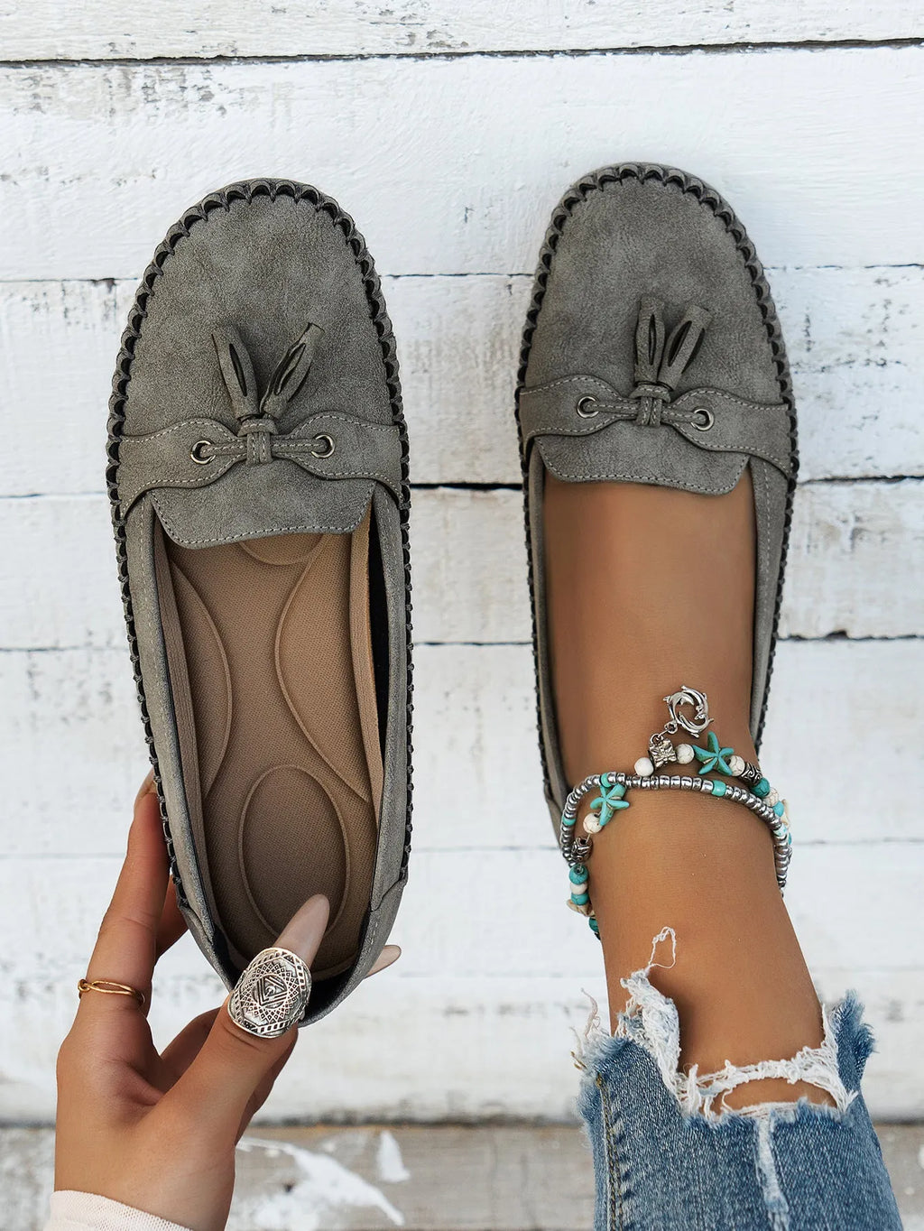 Women's suede flat shoes with a decorative bow in apricot colour