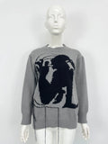 Grey women's loose alpaca wool sweater with tassel detailing and abstract pattern
