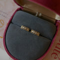 Small lace pattern ear clips in gold or platinum colour on ear model