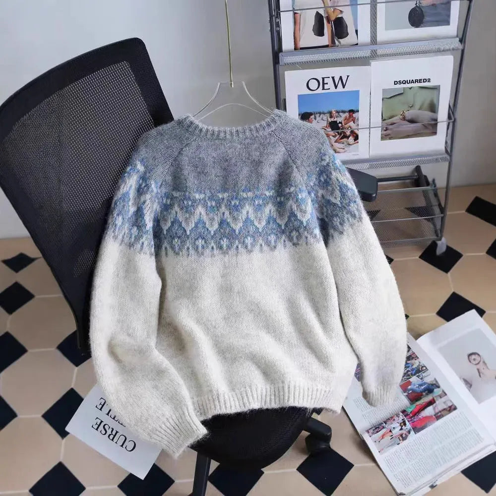Women's beige jacquard knit sweater coat with a loose fit and long sleeves.