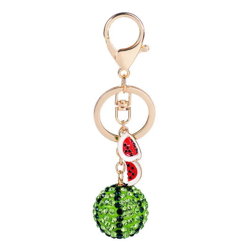 Green zinc alloy watermelon slice keychain measuring 12cm in length.