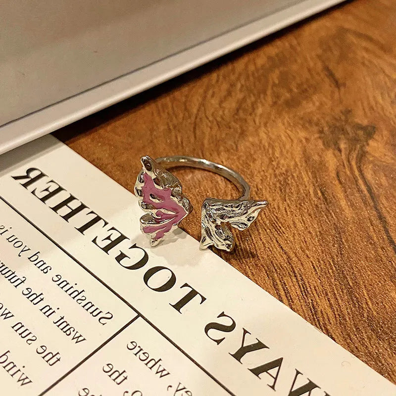 Copper butterfly women's ring with dripping oil texture and an open loop design.