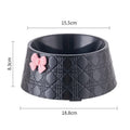 Diamond pattern pet bowl with a decorative bowknot, shown in black, purple, and white colour options.
