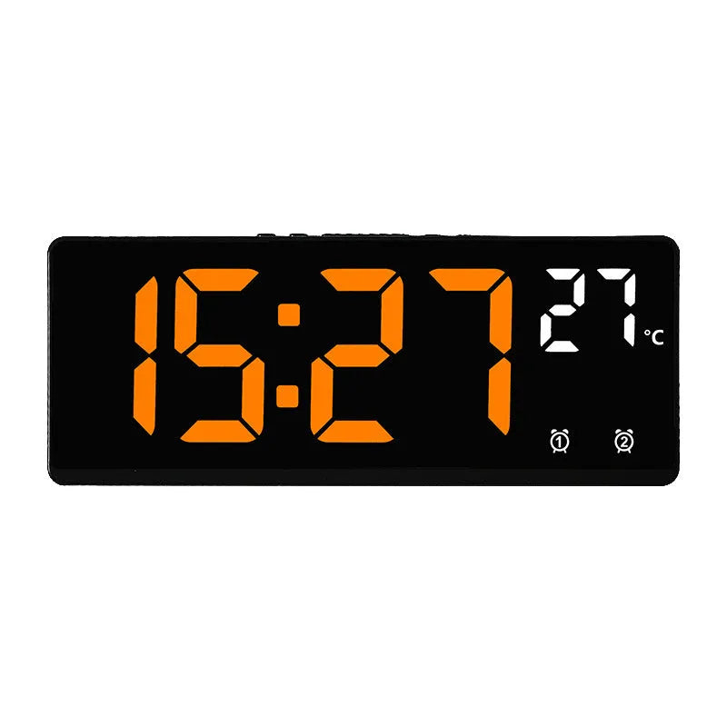 Electronic alarm clock with large LED screen showing time and temperature on desktop