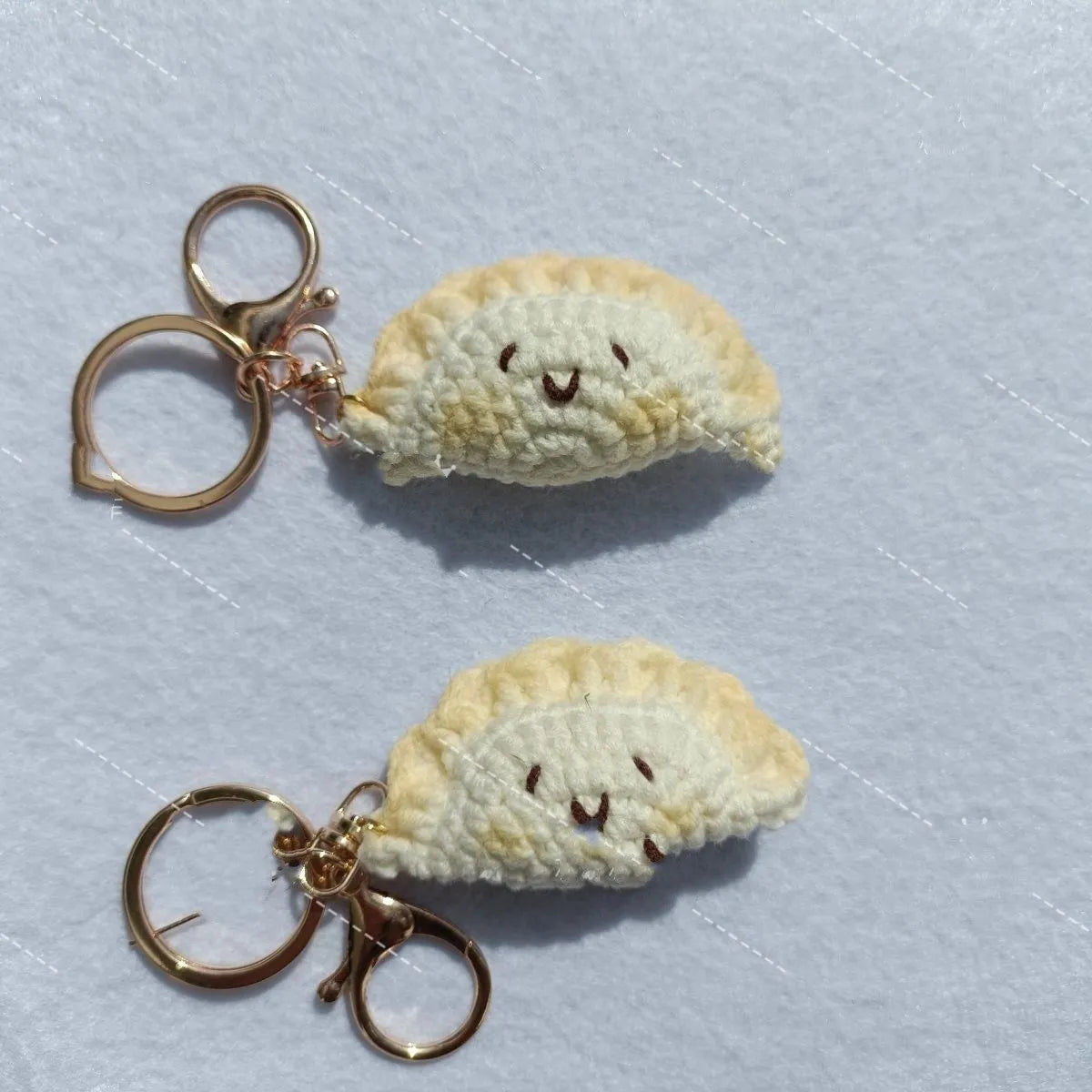 Handmade crochet dumpling pendant with plush material and keychain in traditional dough eye design