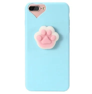 Soft silicone iPhone case with a raised 3D cartoon cat design on the back, shown in pink.