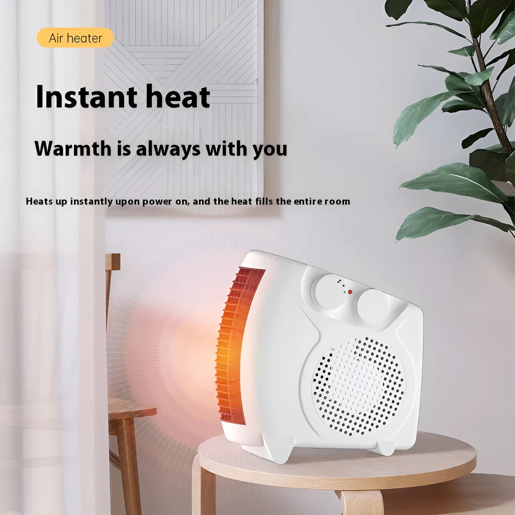 Compact white electric desktop heater with ventilation grille on a desk.