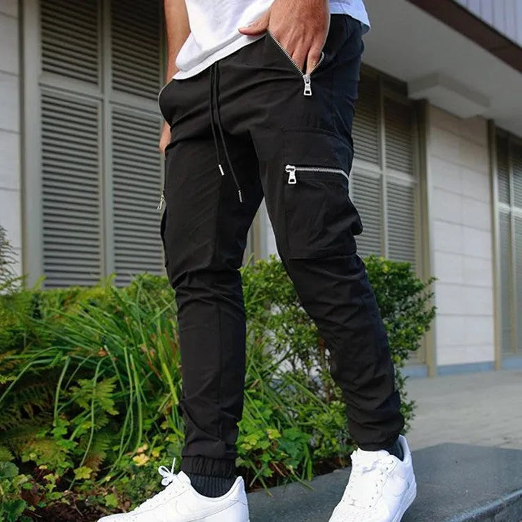 Men's zipper multi-pocket loose casual trousers in black with adjustable belt and small leg opening