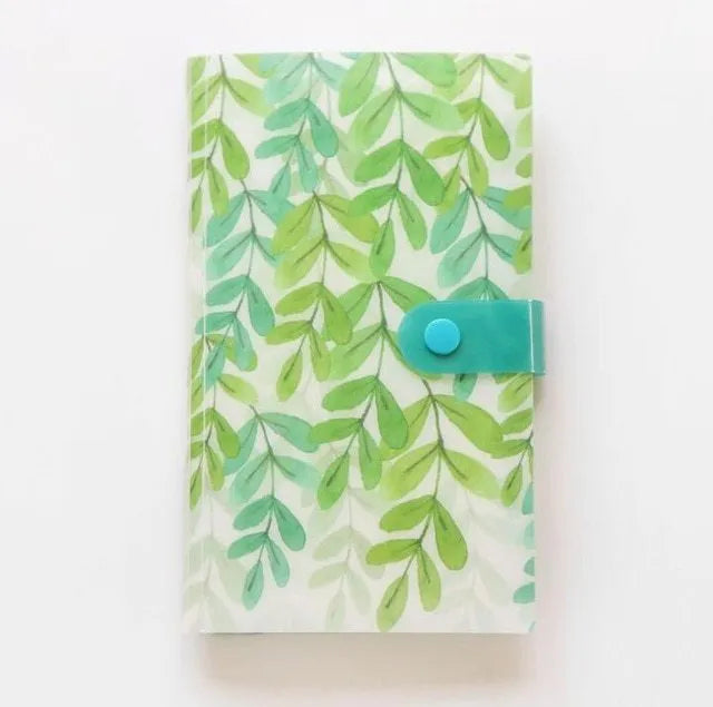 Blue PVC and PP business card holder book with protective shell, showing smile logo and insert slots.