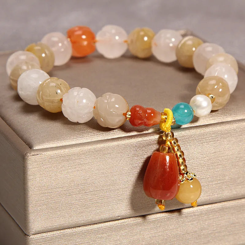 Yellow agate crystal bracelet on a gold silk cord, showing khaki colour and Japanese-Korean style.