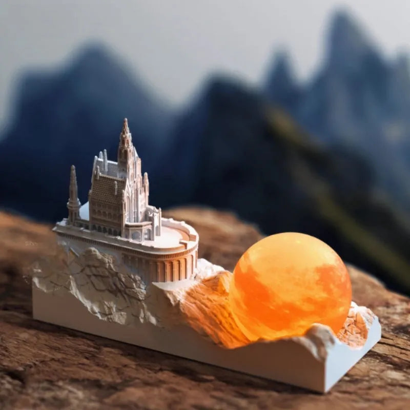 Mountain-shaped aromatherapy night light with touch control, LED lamp, essential oil and card gift set on a desk