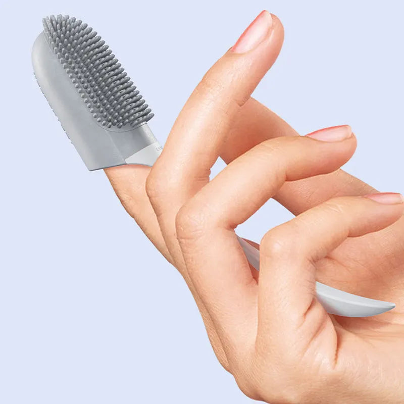 Pink reusable finger toothbrush for dogs and cats, with PP+TPR soft bristles, on white background