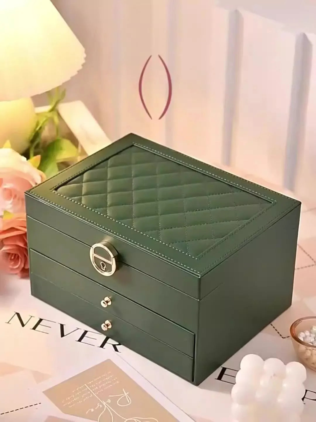 Leather jewellery box with three drawers open, showing storage for necklaces, earrings and bracelets.