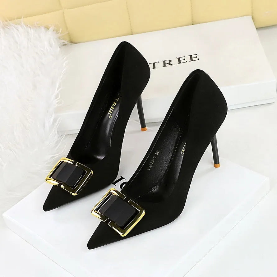 Black suede women's stiletto high heels with a pointed toe and a 9cm heel on a rubber sole.