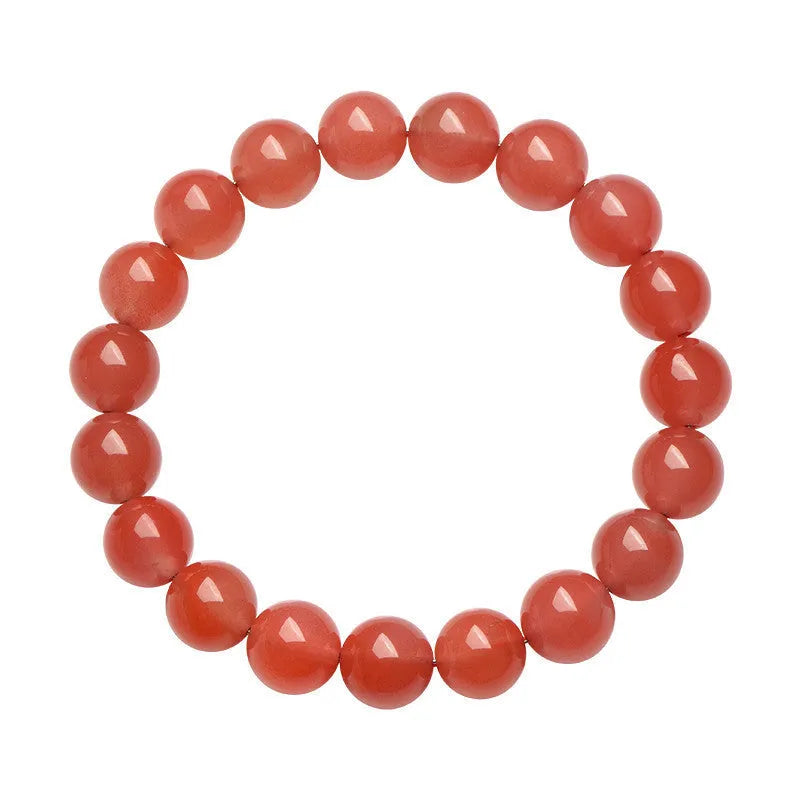 Natural cherry red agate bead bracelet with polished stones on a neutral background, showing single strand and bead detail.