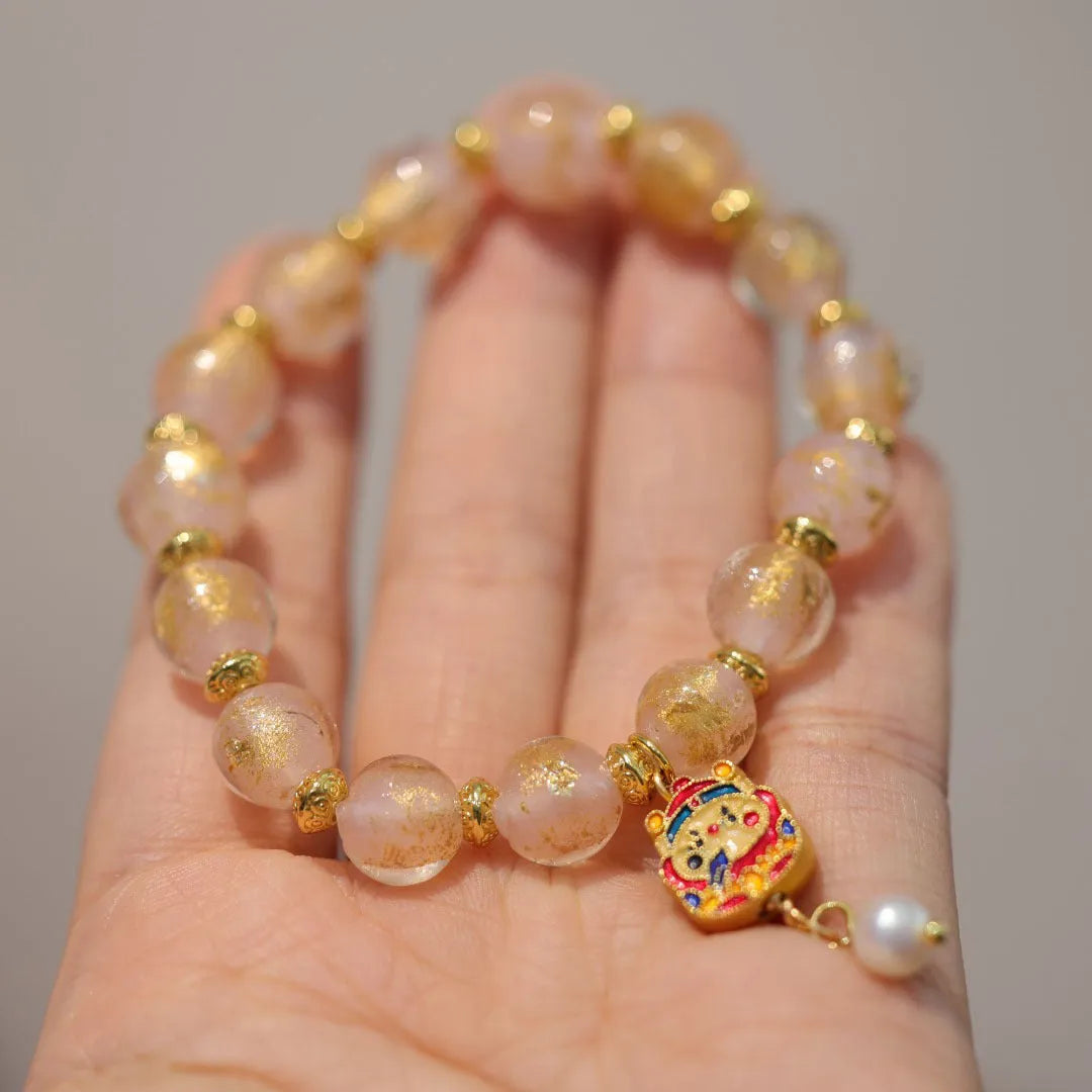 Women's ethnic style geometric bracelet with gold foil coloured glaze in Xingshi design