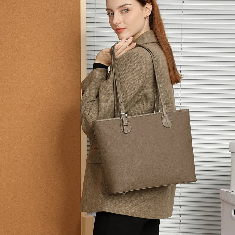 Genuine leather women's tote bag in retro style showing multiple compartments and horizontal suitcase shape