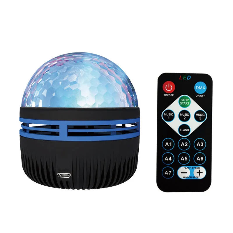 Compact white LED star projector lamp on a table, projecting galaxy light patterns on a dark wall.