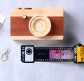 Kodak yellow wooden memory colour film album boxes stacked with a tote bag