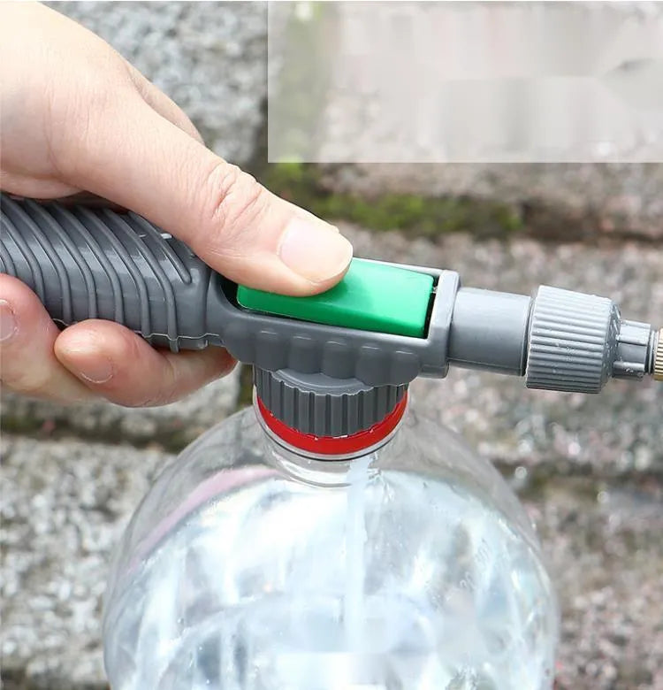 Grey watering sprayer nozzle attached to plastic bottle with 30cm connecting tube for garden watering