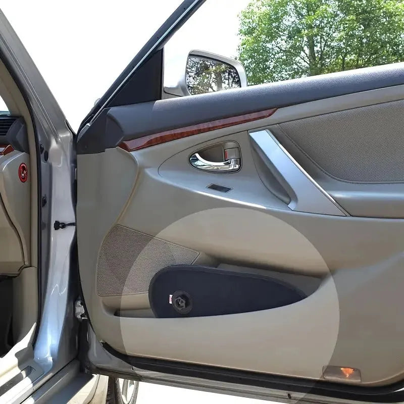 Black breathable mesh car sun shade stretched over a car side window, showing suction cups.