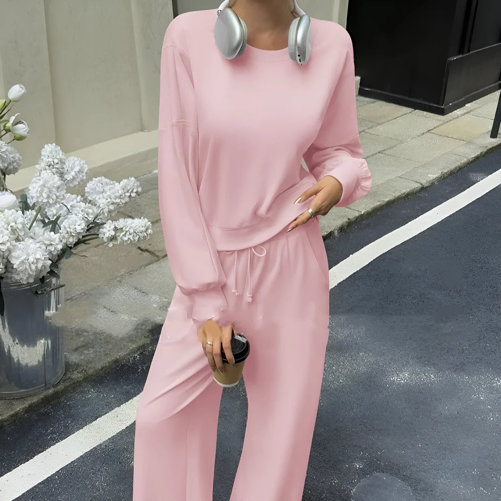 Women's solid colour two-piece set with long sleeve top and matching trousers in polyester fabric
