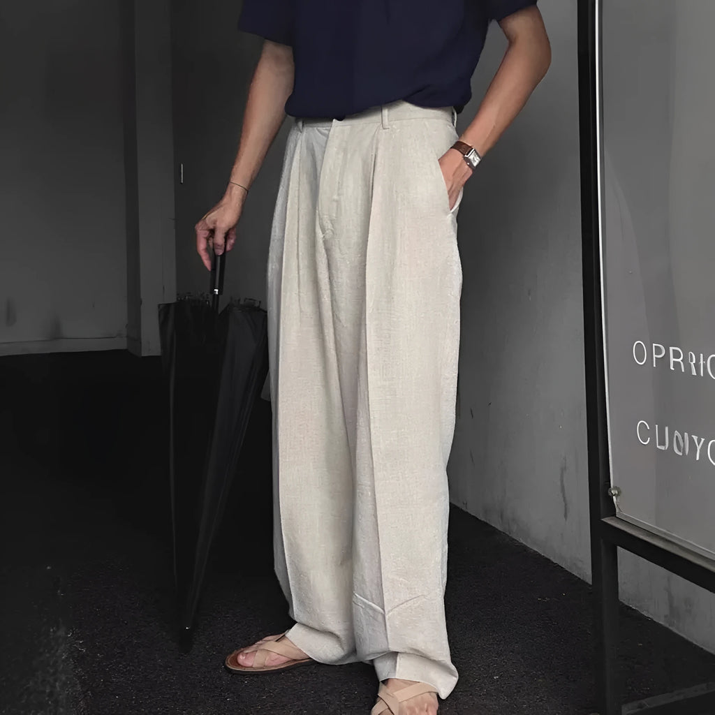 Men's loose-fit apricot coloured cotton linen blend trousers with a straight leg and elastic waistband.