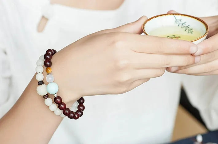 Natural white jade Bodhi bracelet with round beads and transfer bead on white background