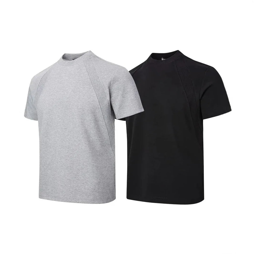 Man wearing a loose-fit grey short-sleeve top with textured air layer stitching detail.