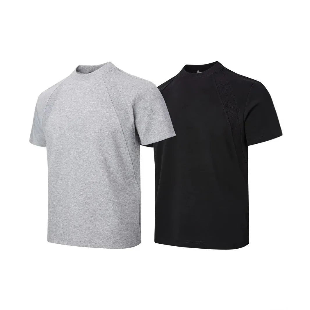 Man wearing a loose-fit grey short-sleeve top with textured air layer stitching detail.
