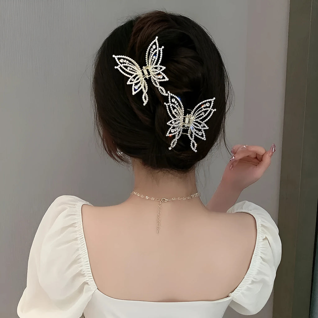 Butterfly-shaped alloy hair clip for women with rhinestone or pearl decoration.