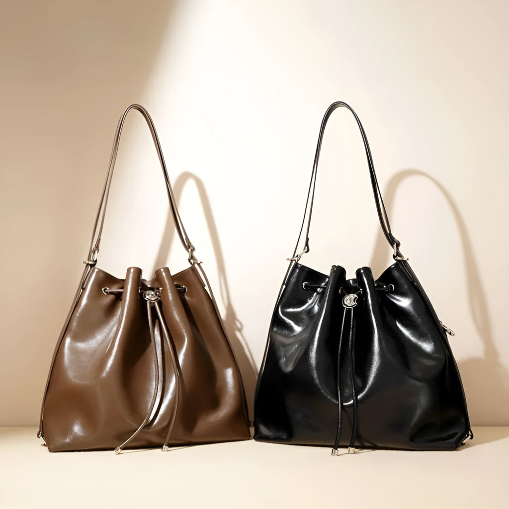 Genuine leather retro one-shoulder bucket bag in burgundy showing interior zipper and file pockets