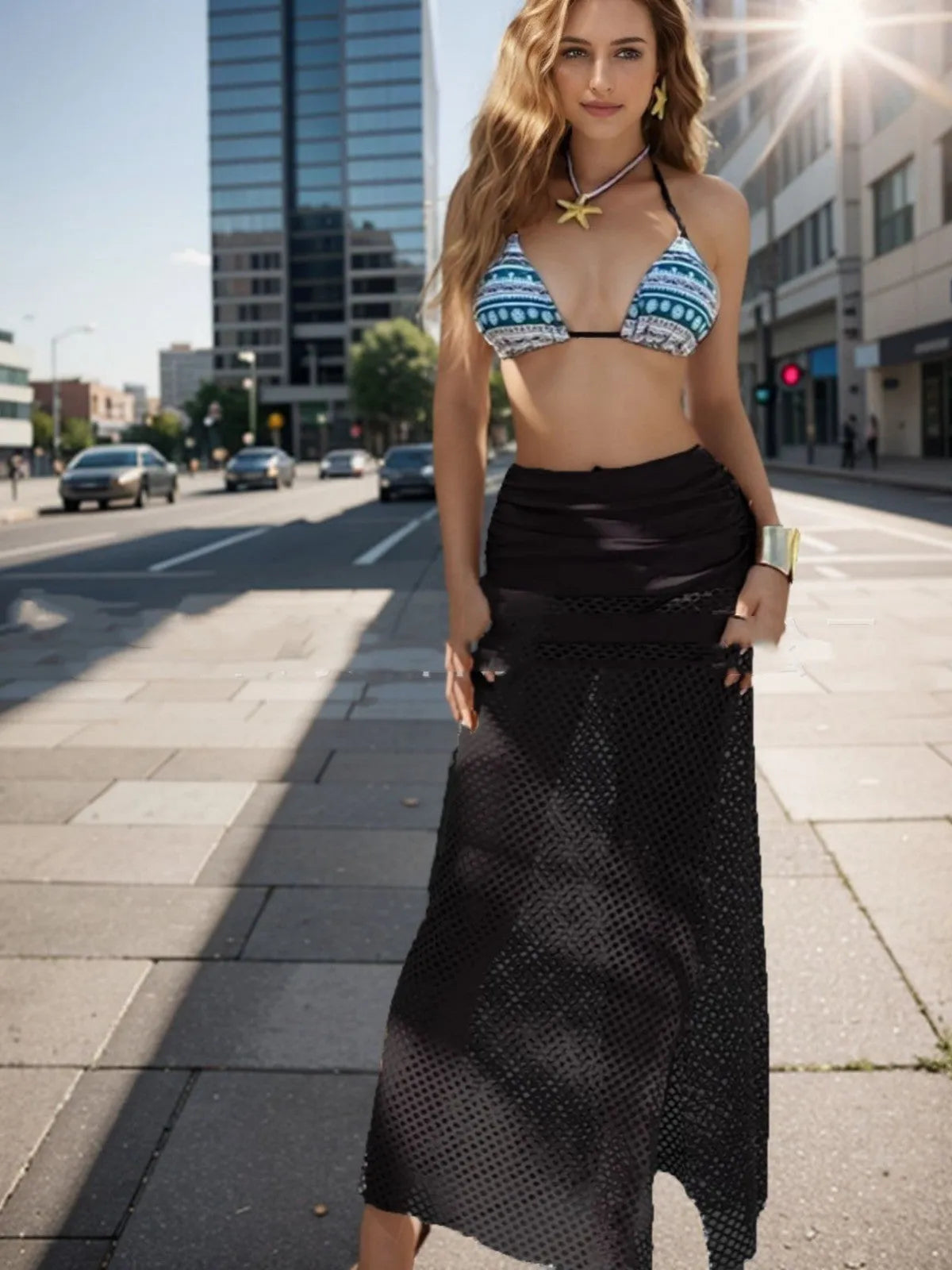 Women's black bikini and fishnet long skirt three-piece swimwear set on a mannequin.